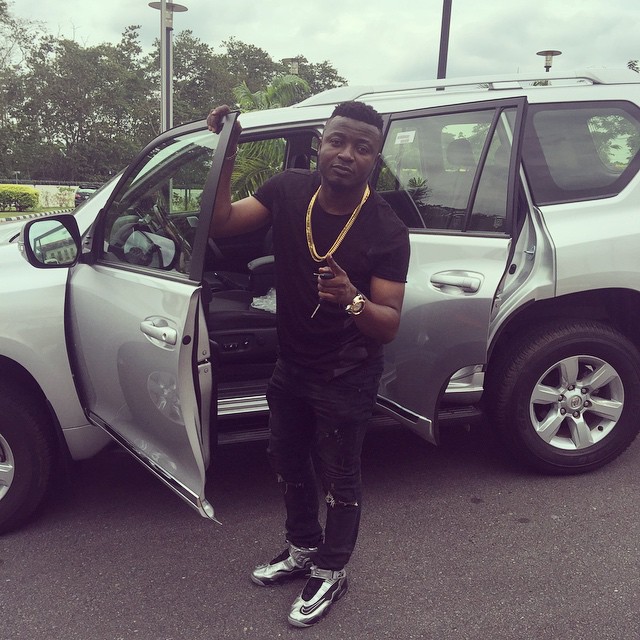MC Galaxy with the Land Cruiser given to him by former Akwa Ibom governor, Godswill Akpabio