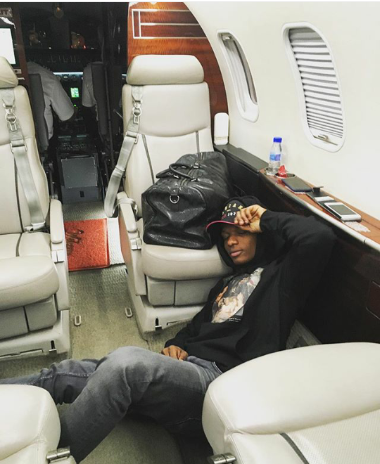 Wizkid Shows Off Stylish Look As He Takes Photos